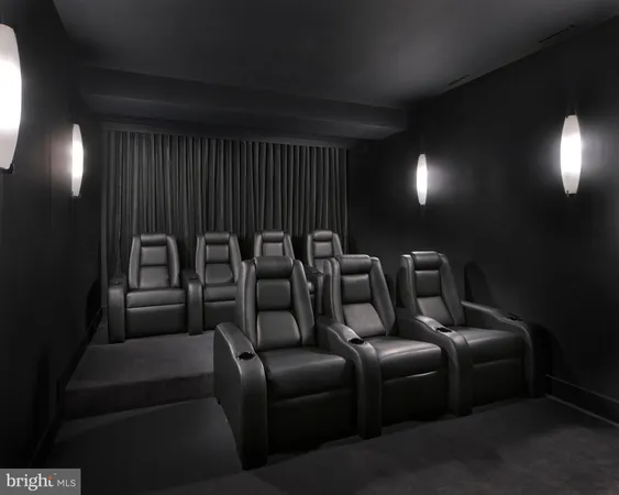 a media room with lots of chairs and a projector