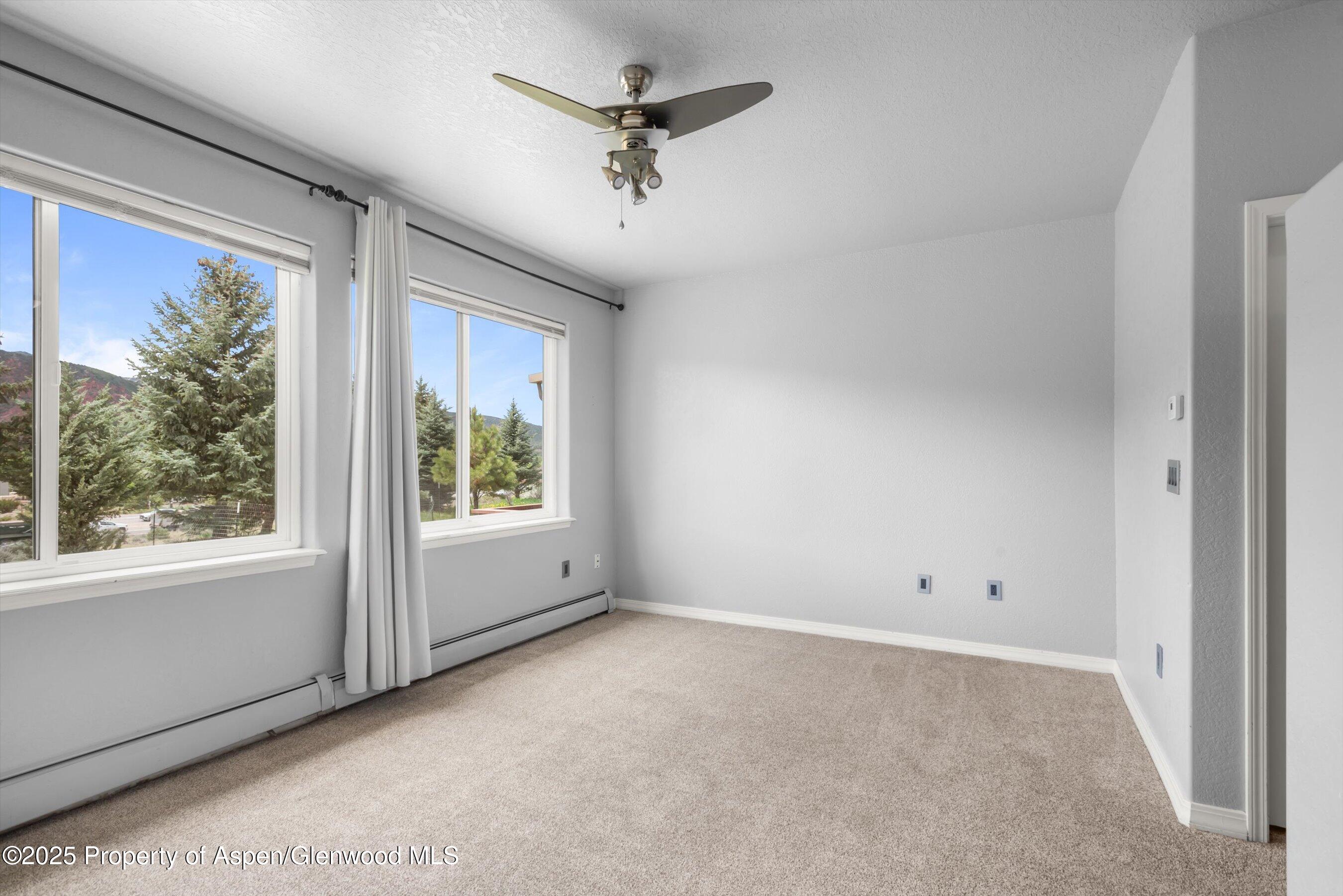 21 Pine Ridge Road Basalt, CO 81621 - Photo 11 of 25 an empty room with a window and a ceiling fan