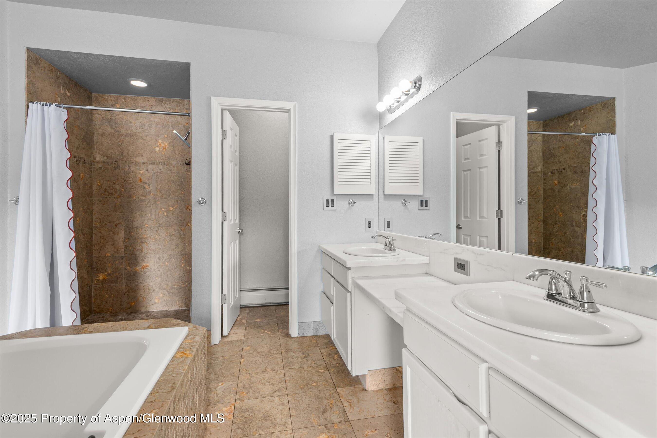 21 Pine Ridge Road Basalt, CO 81621 - Photo 12 of 25 a bathroom with double sink and a mirror