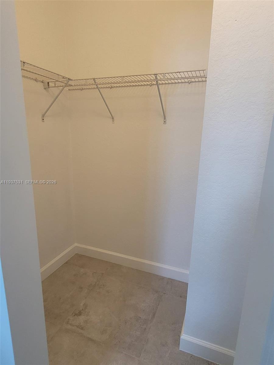 2685 Southeast 13th Street Homestead, FL 33035 - Photo 11 of 18 a view of small space with racks on the wall