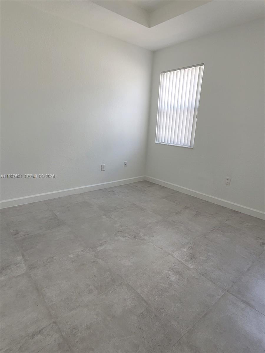 2685 Southeast 13th Street Homestead, FL 33035 - Photo 15 of 18 an empty room with windows