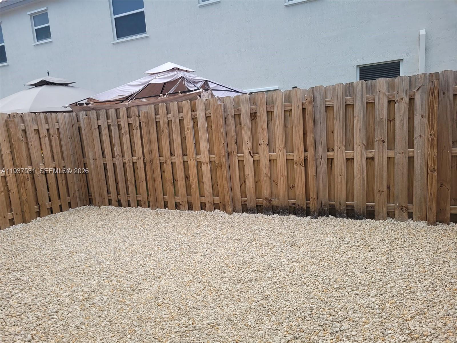2685 Southeast 13th Street Homestead, FL 33035 - Photo 18 of 18 a view of wooden fence of a house