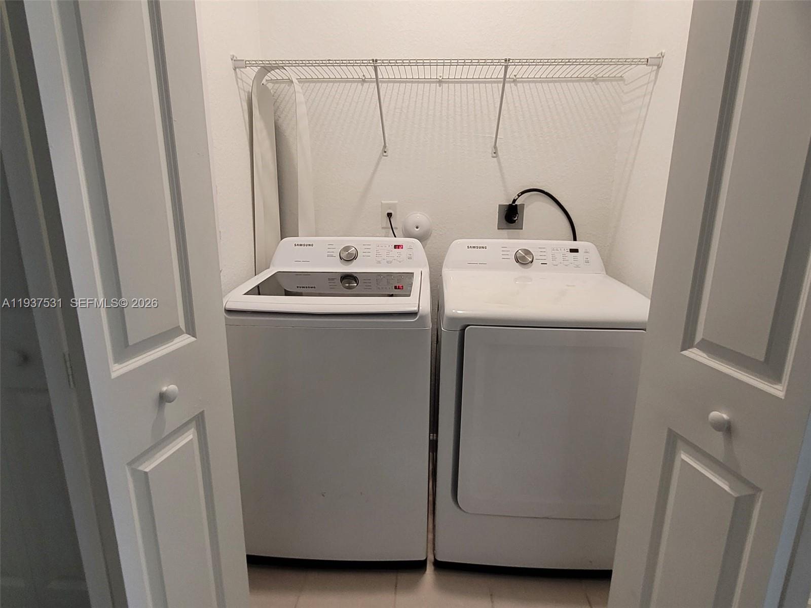 2685 Southeast 13th Street Homestead, FL 33035 - Photo 8 of 18 a utility room with dryer and washer