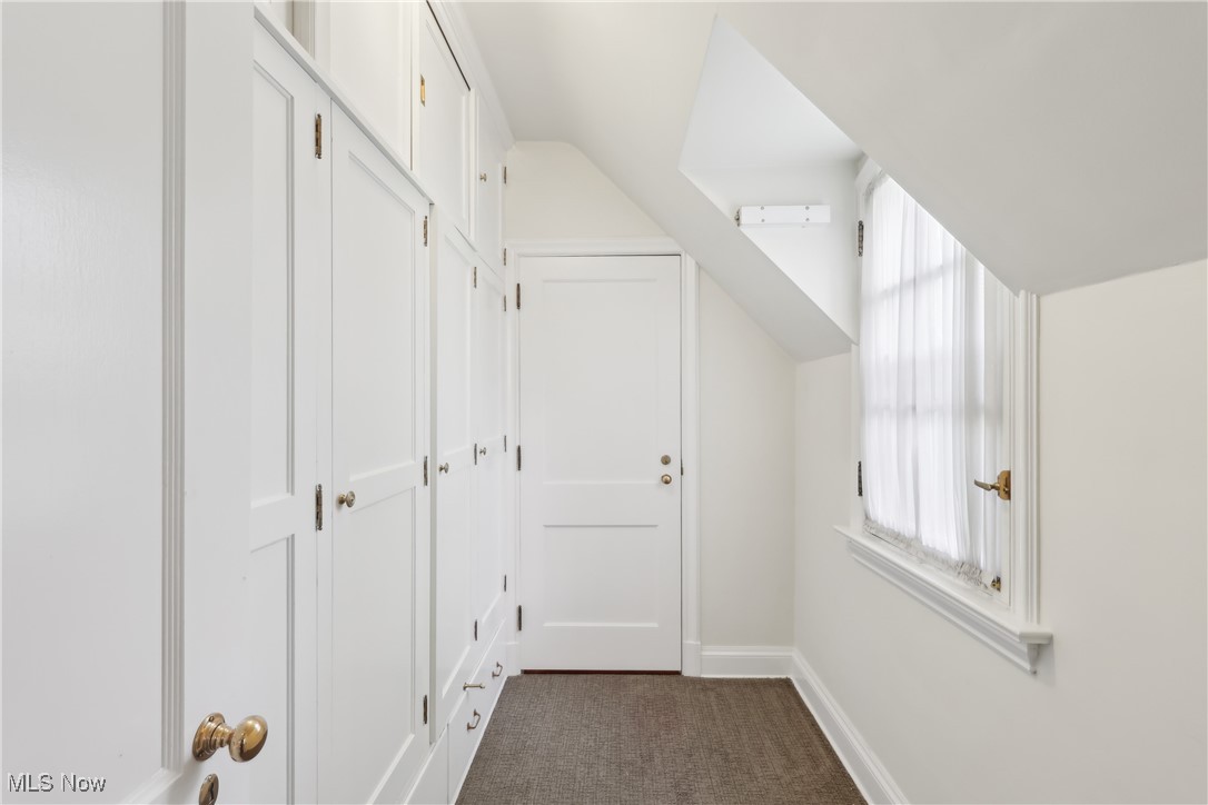 800 Merriman Road Akron, OH 44303 - Photo 32 of 42 Corridor with dark carpet and baseboards
