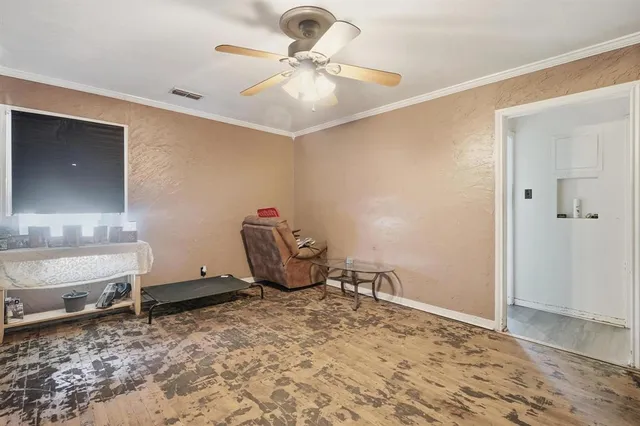 a view of a workspace with furniture and chandelier