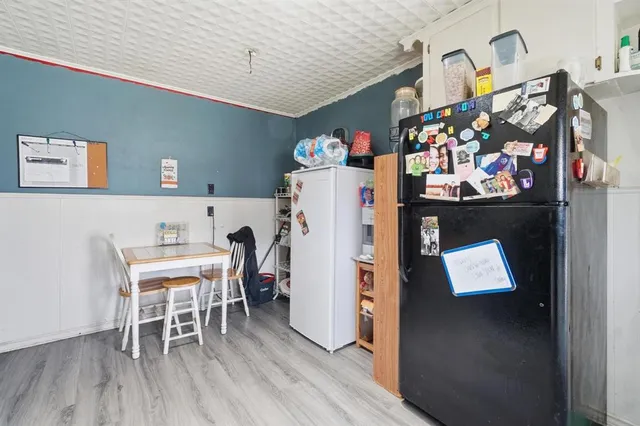 a view of dining room with furniture and wooden floor