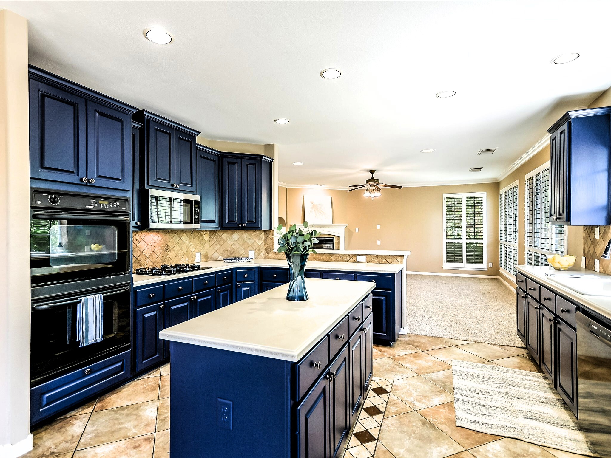 12935 Brigham Drive Austin, TX 78732 - Photo 8 of 35 Kitchen - stunning navy blue cabinets (darker in person) give the kitchen a cool modern look