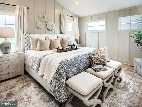 a bed room with a bed and a chair