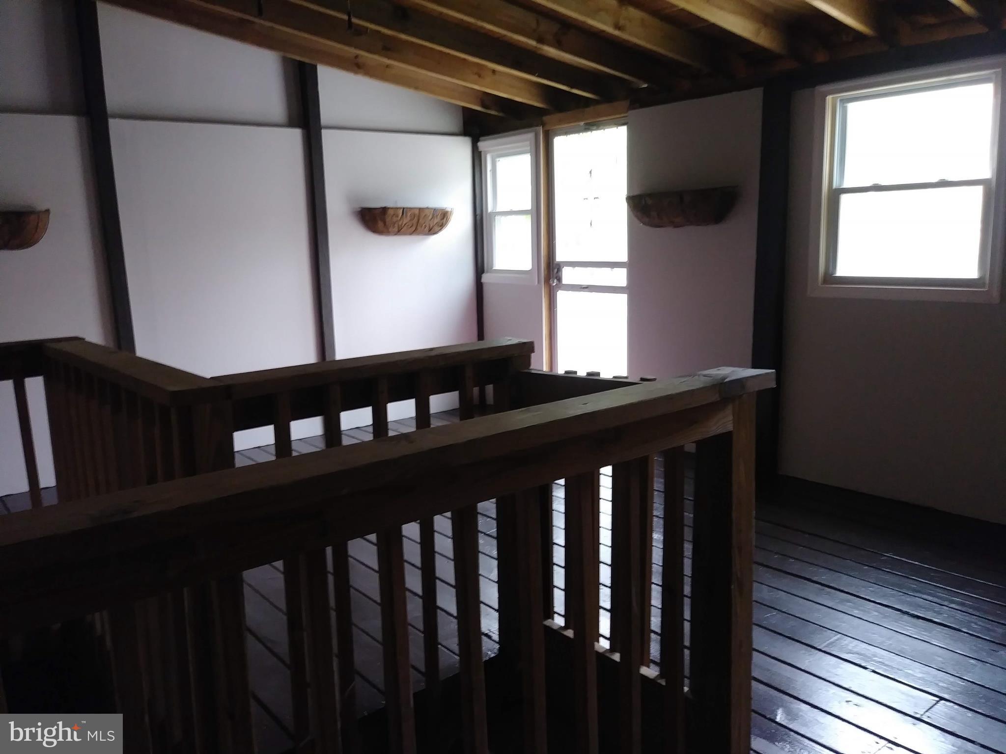 3812 Ednor Road Baltimore, MD 21218 - Photo 20 of 22 a view of a black and white wooden floor