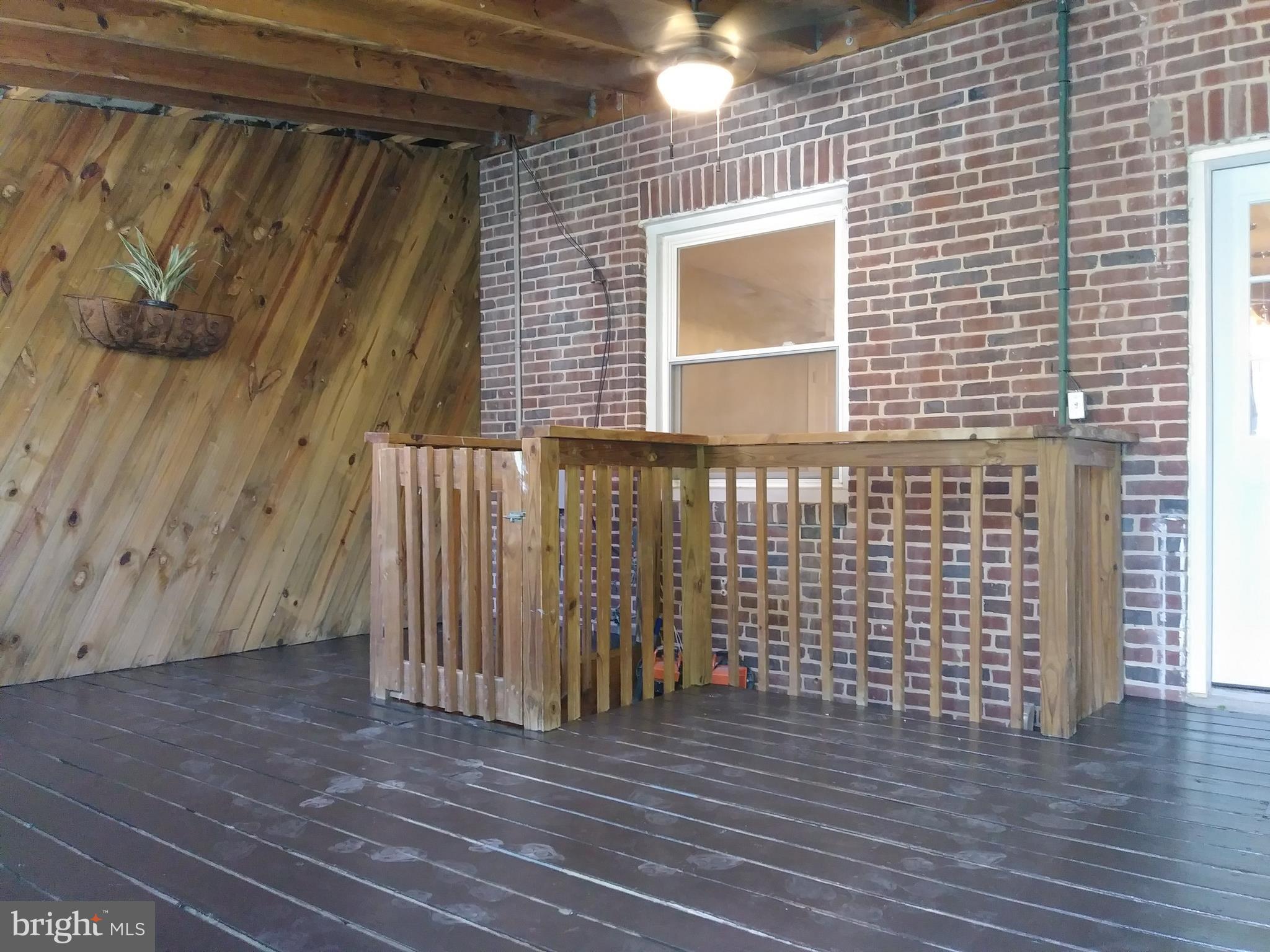 3812 Ednor Road Baltimore, MD 21218 - Photo 21 of 22 a view of a brick house with wooden floor