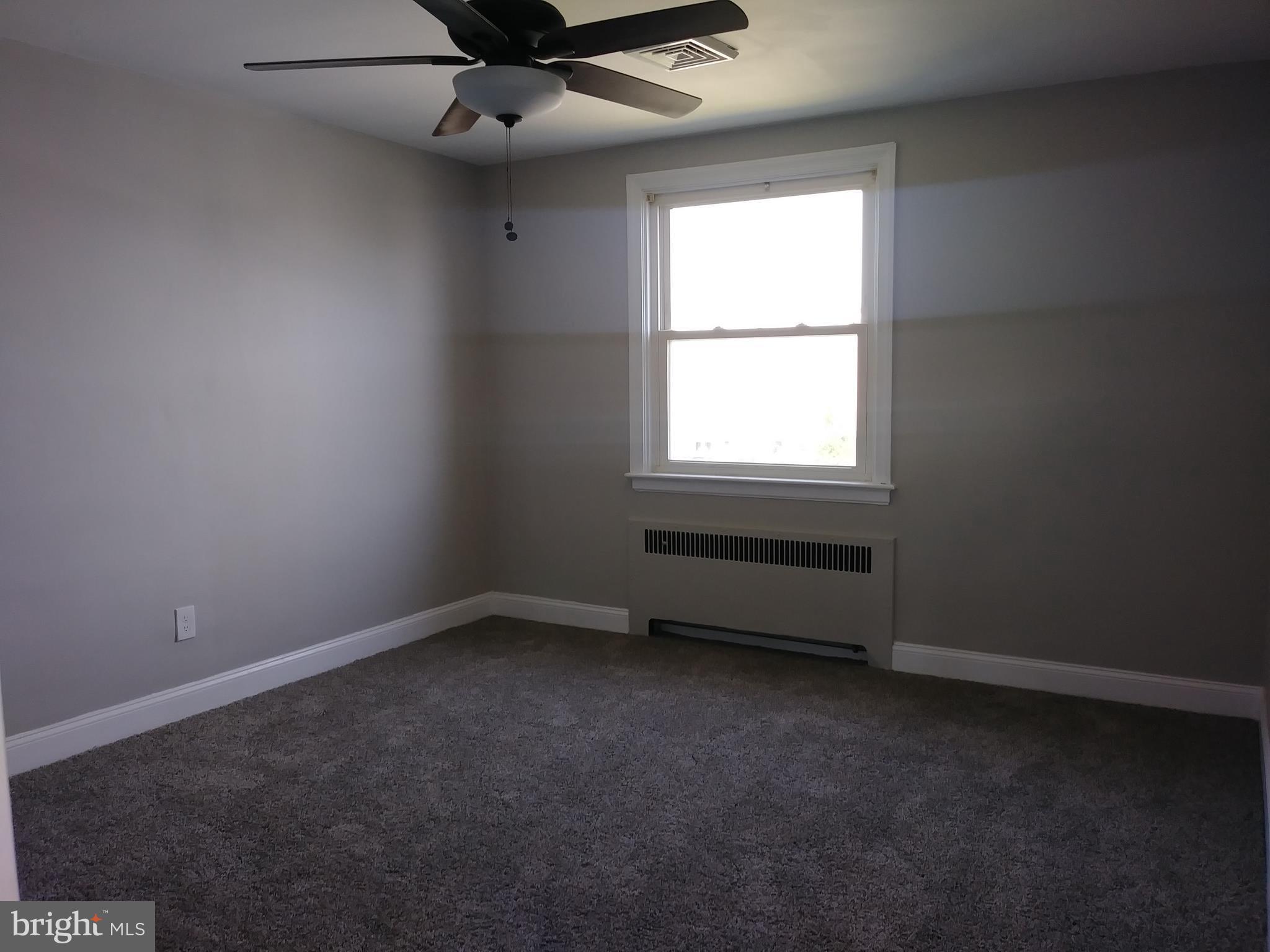 3812 Ednor Road Baltimore, MD 21218 - Photo 8 of 22 an empty room with a window