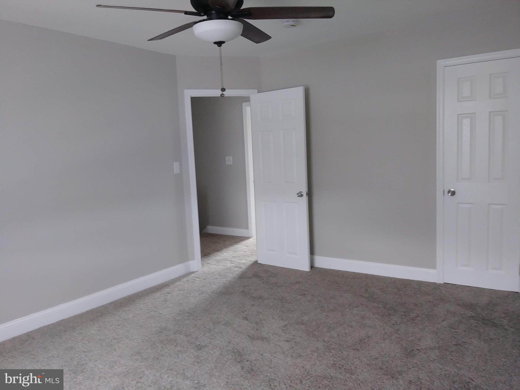 3812 Ednor Road Baltimore, MD 21218 - Photo 9 of 22 an empty room with a empty space