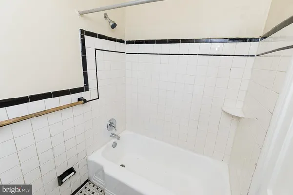 a bathroom with a shower and a bathtub