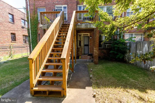a view of a yard from a balcony