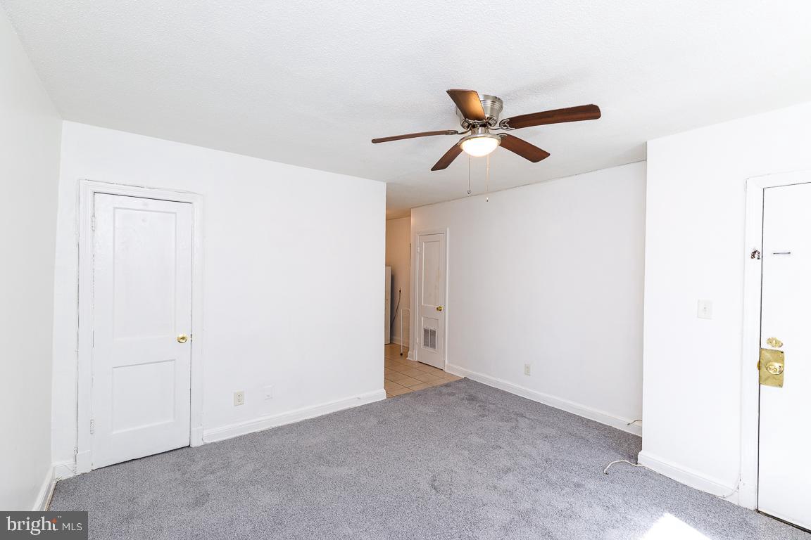 430 Mellon Street Southeast, Unit 2 Washington, DC 20032 - Photo 5 of 20 a view of a ceiling fan and hardwood floor