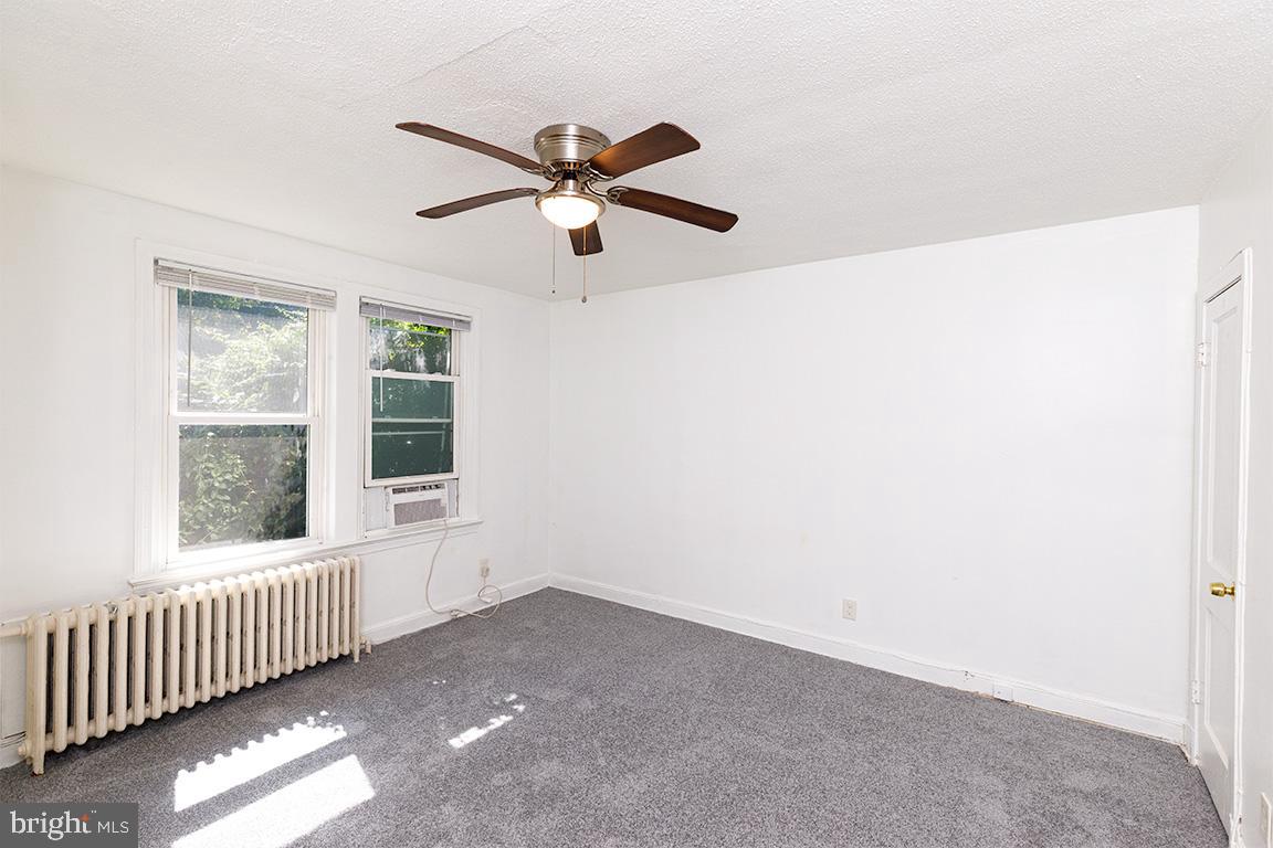 430 Mellon Street Southeast, Unit 2 Washington, DC 20032 - Photo 7 of 20 a view of a livingroom with a ceiling fan and window