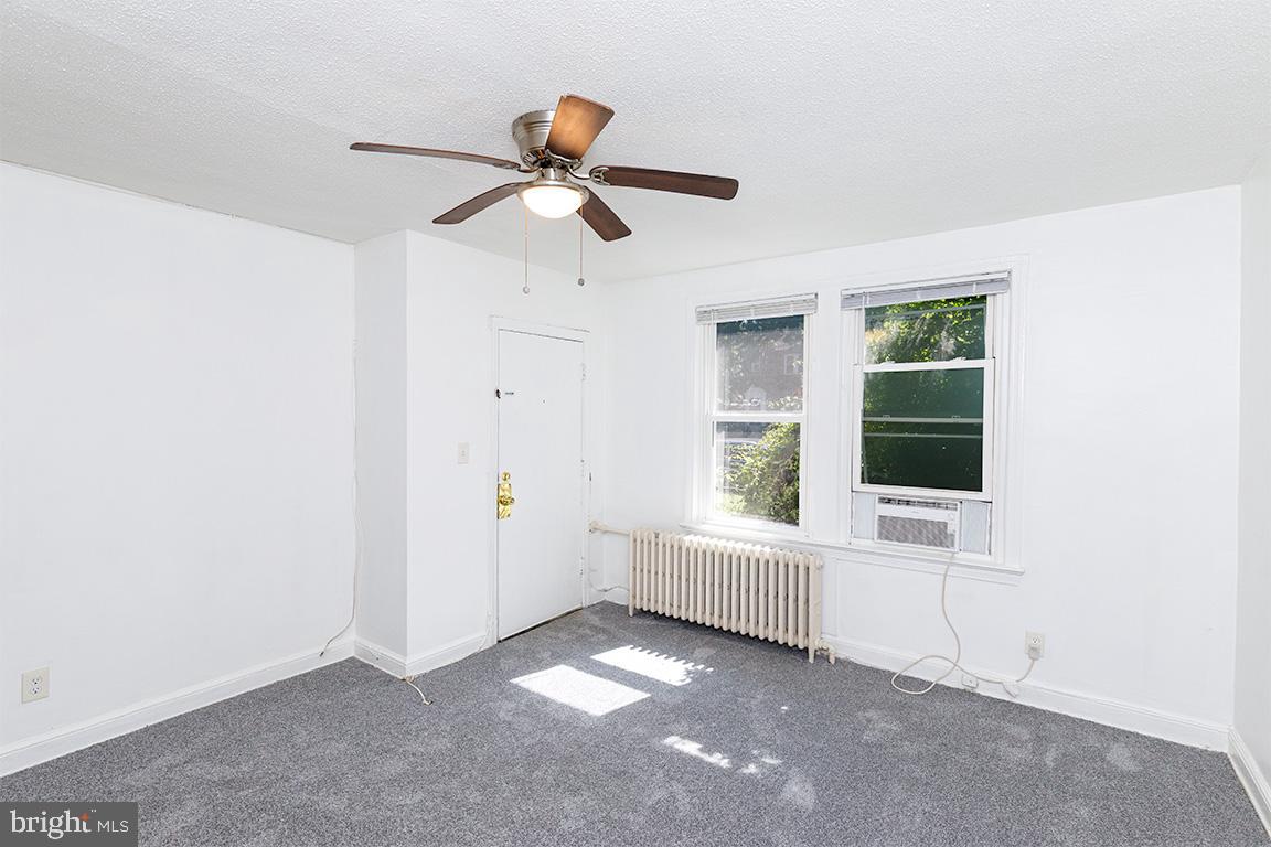 430 Mellon Street Southeast, Unit 2 Washington, DC 20032 - Photo 8 of 20 a view of an empty room with a window