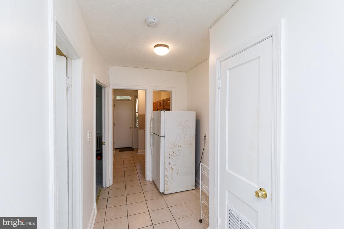 430 Mellon Street Southeast, Unit 2 Washington, DC 20032 - Photo 9 of 20 a view of a storage & utility room with refrigerator
