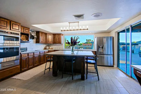 a swimming pool with outdoor seating and yard