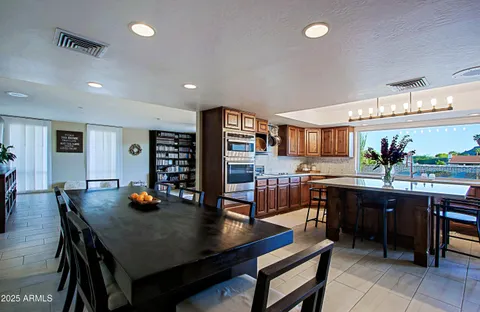 a patio with a table and chairs
