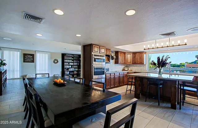 a patio with a table and chairs