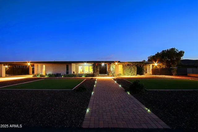 a kitchen with stainless steel appliances wooden floors stove and dining table