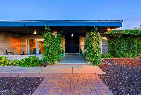 a view of a dining room with furniture and window