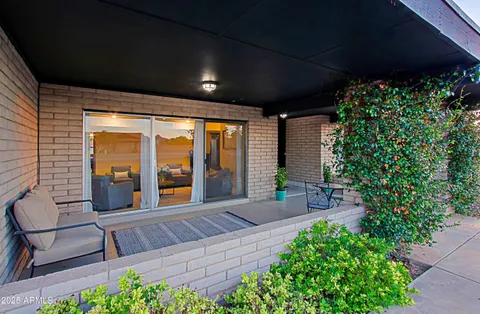a living room with stainless steel appliances kitchen island granite countertop furniture and a kitchen view