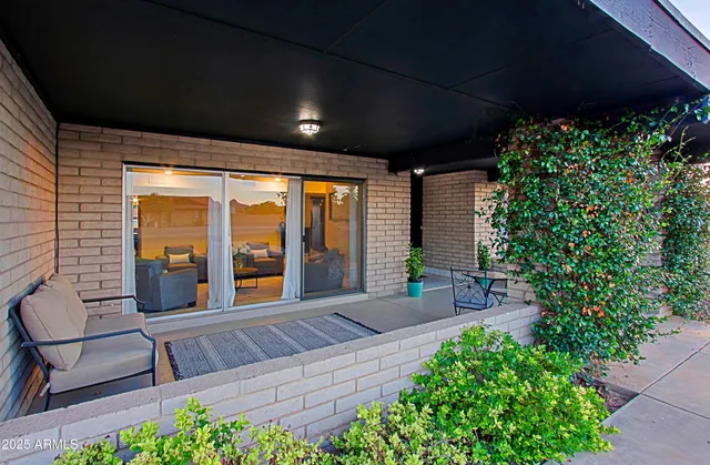 a living room with stainless steel appliances kitchen island granite countertop furniture and a kitchen view