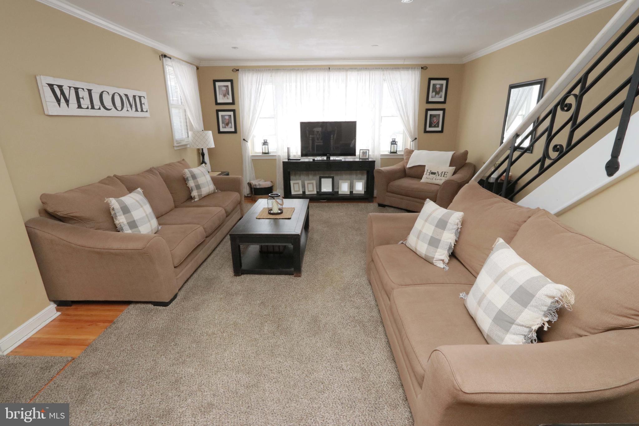 8134 Revere Street Philadelphia, PA 19152 - Photo 16 of 49 a living room with furniture and a flat screen tv