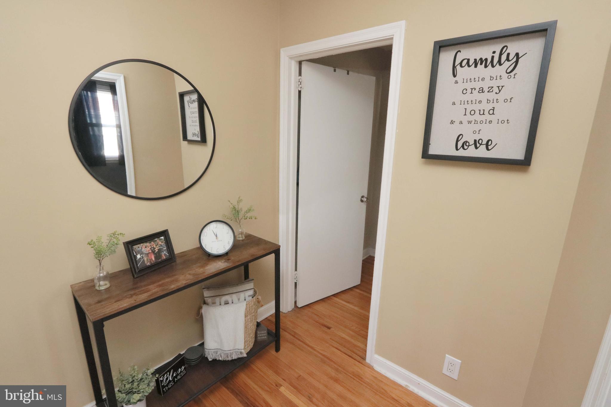 8134 Revere Street Philadelphia, PA 19152 - Photo 21 of 49 a view of a hallway with wooden floor and white walls