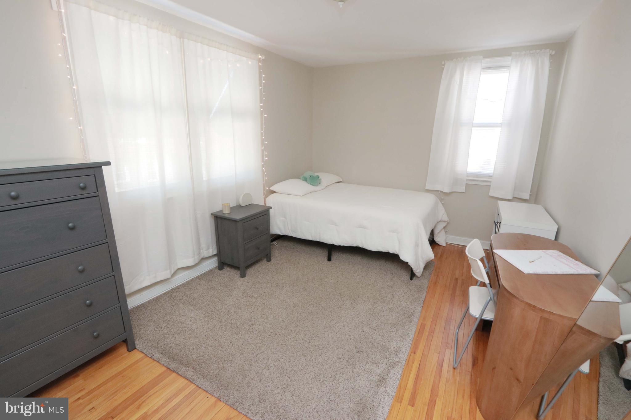 8134 Revere Street Philadelphia, PA 19152 - Photo 30 of 49 a bedroom with a bed and a window