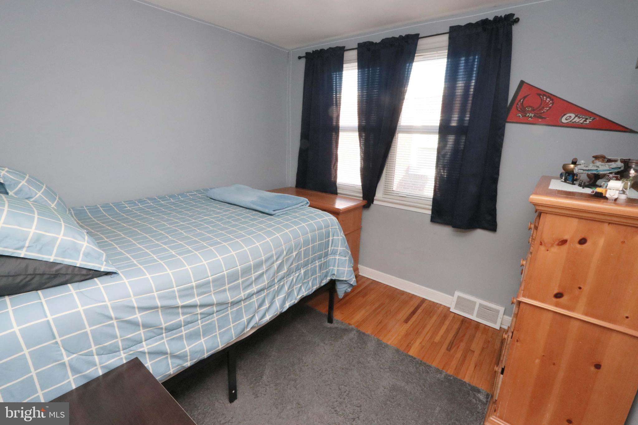 8134 Revere Street Philadelphia, PA 19152 - Photo 31 of 49 a bedroom with a bed and a window