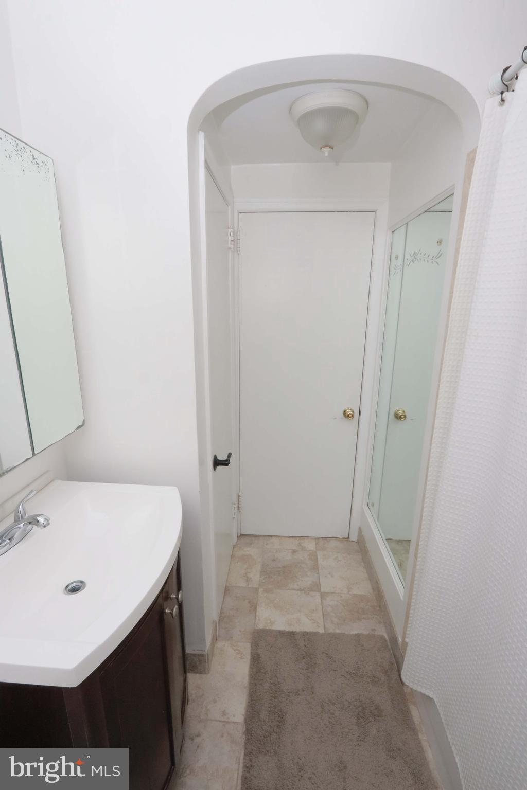 8134 Revere Street Philadelphia, PA 19152 - Photo 37 of 49 a bathroom with a sink and a mirror