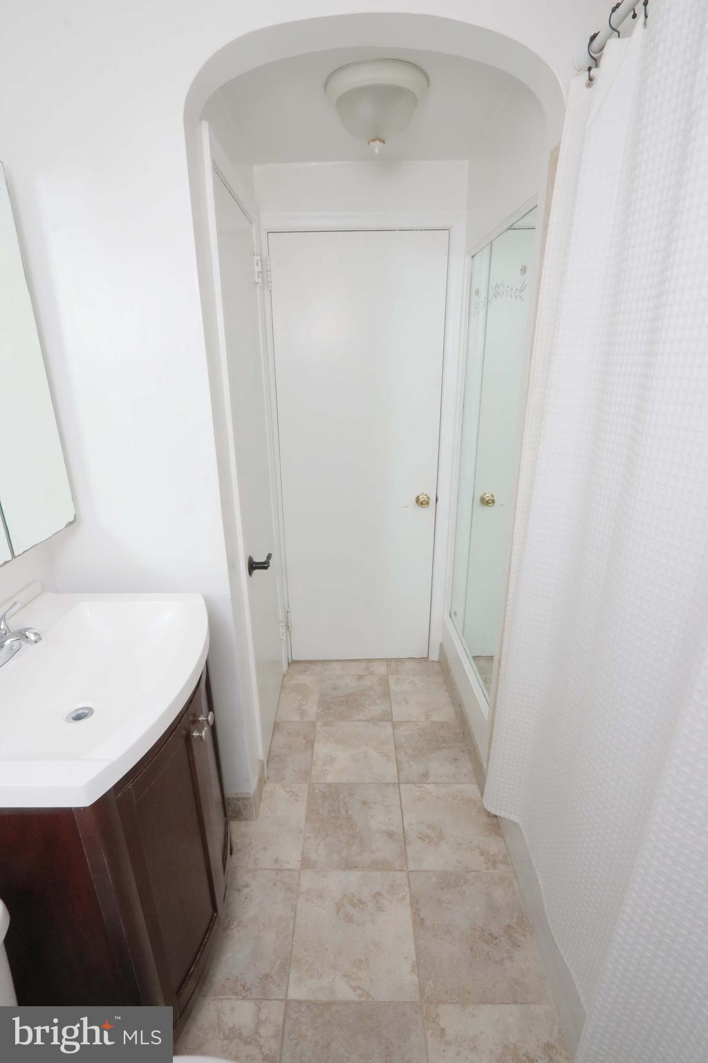 8134 Revere Street Philadelphia, PA 19152 - Photo 39 of 49 a bathroom with a sink and a mirror