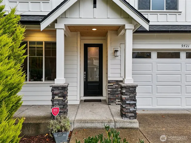 a front view of a house with a garage