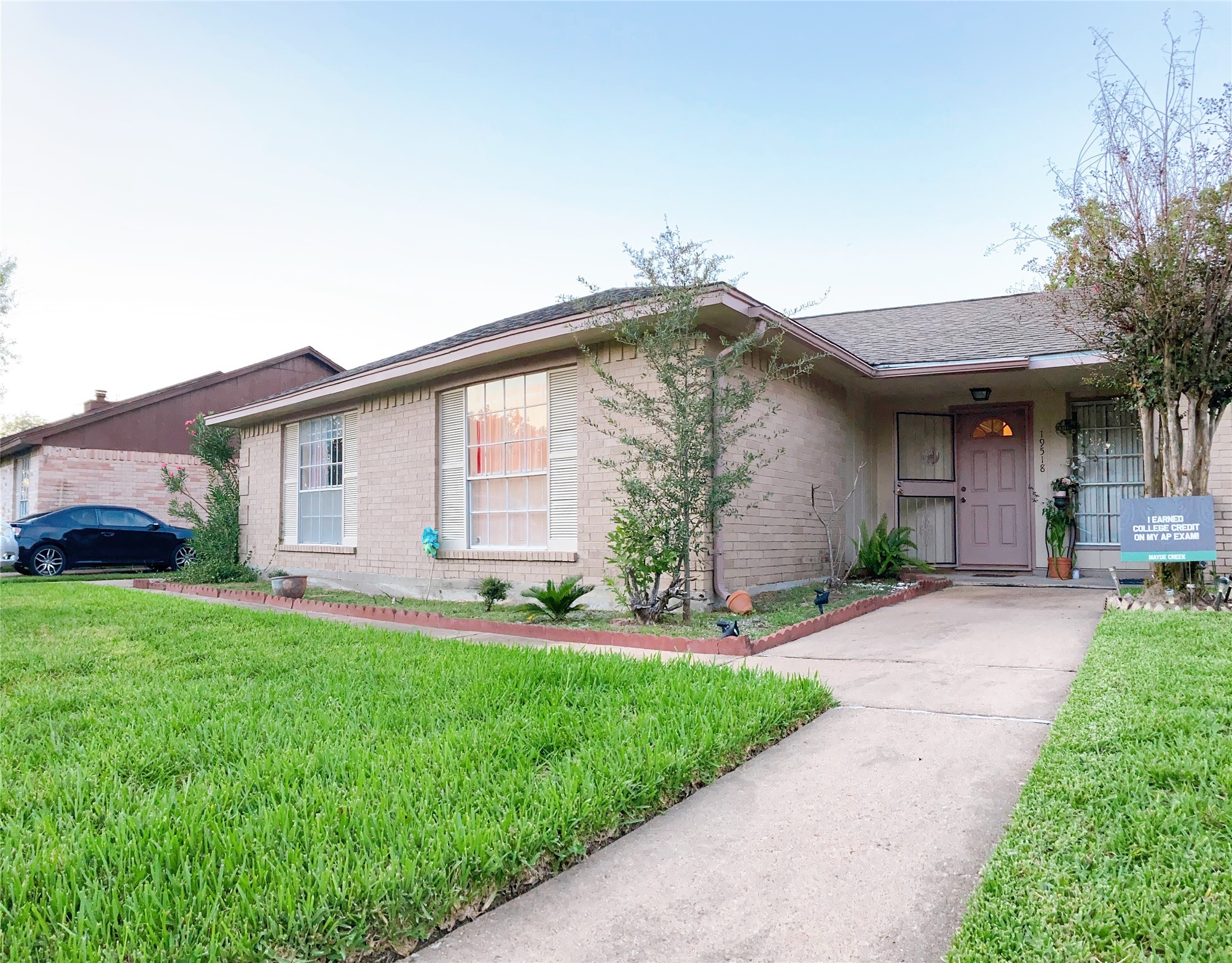 19518 Munsey Court Katy, TX 77449 - Photo 2 of 45 a front view of a house with a yard and garage
