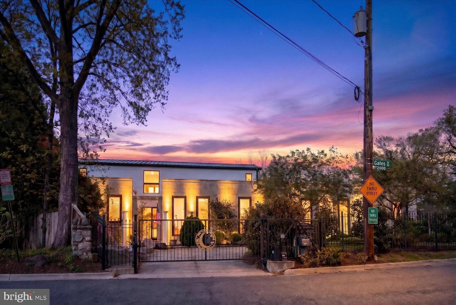 3017 Gates Road Northwest Washington, DC 20008 - Photo 91 of 95 Modern home under a vibrant sunset.