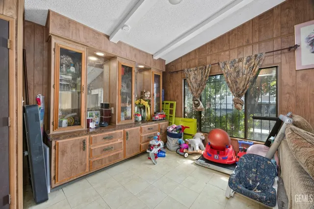 a view of a room with furniture and toys
