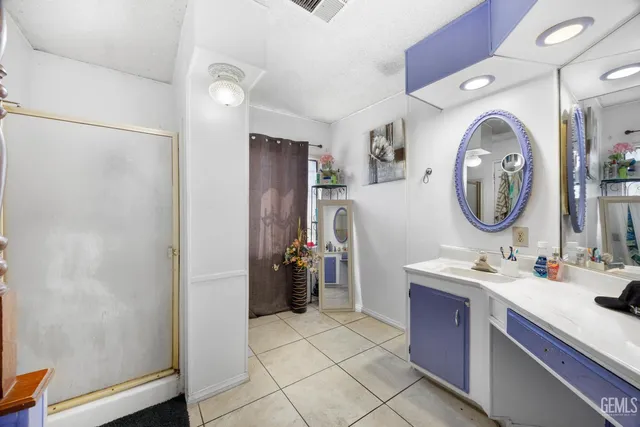 a room with a sink and a mirror