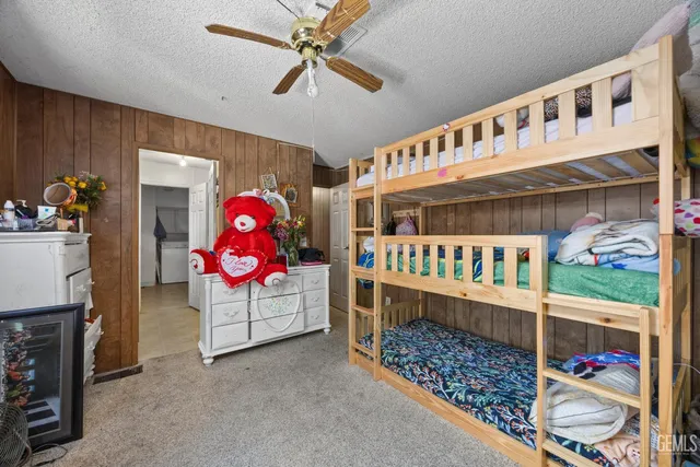 a bathroom with a sink mirror and toilet