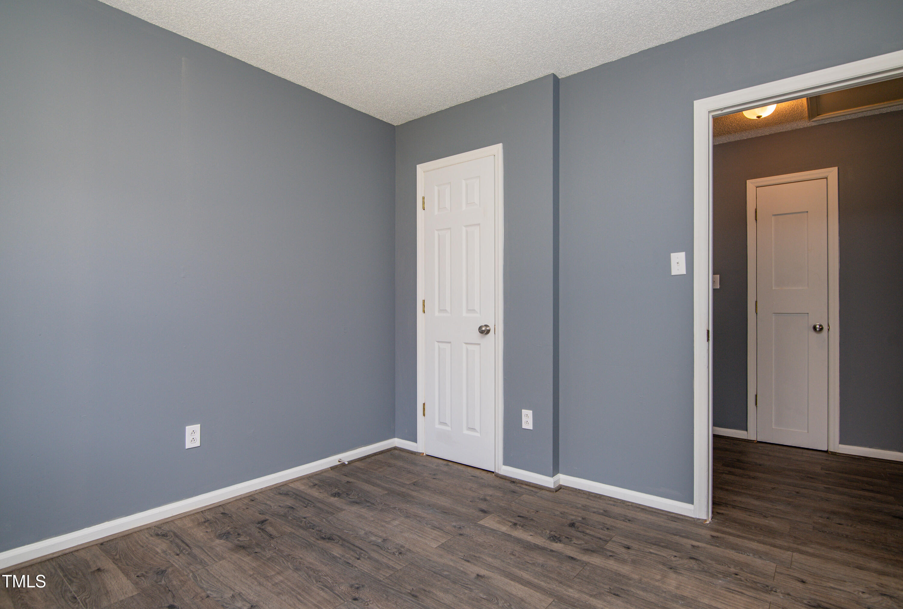 5046 Mrs Mag Road Conway, NC 27820 - Photo 13 of 38 a view of an empty room with wooden floor and closet