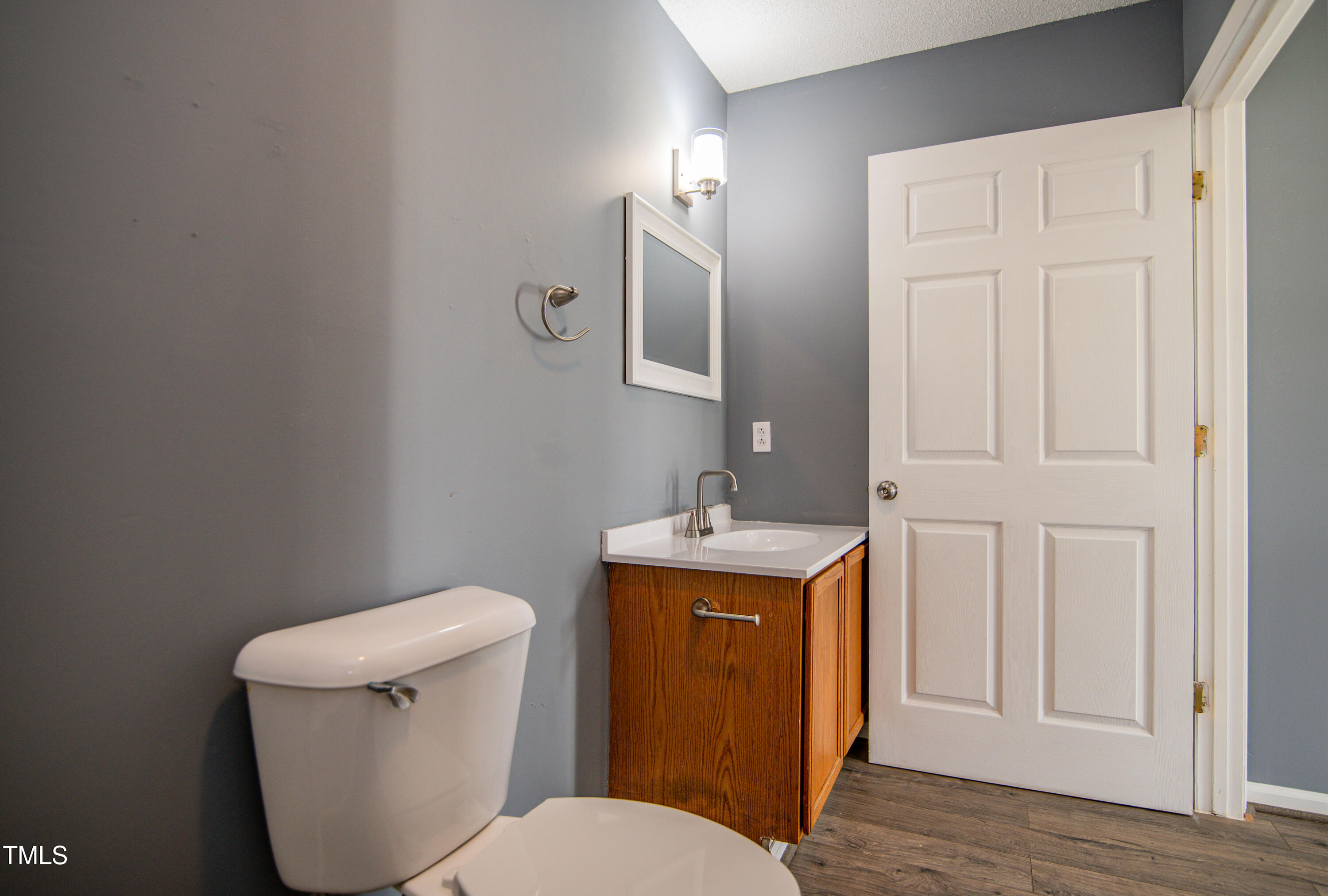 5046 Mrs Mag Road Conway, NC 27820 - Photo 16 of 38 a white toilet sitting next to a bathroom sink