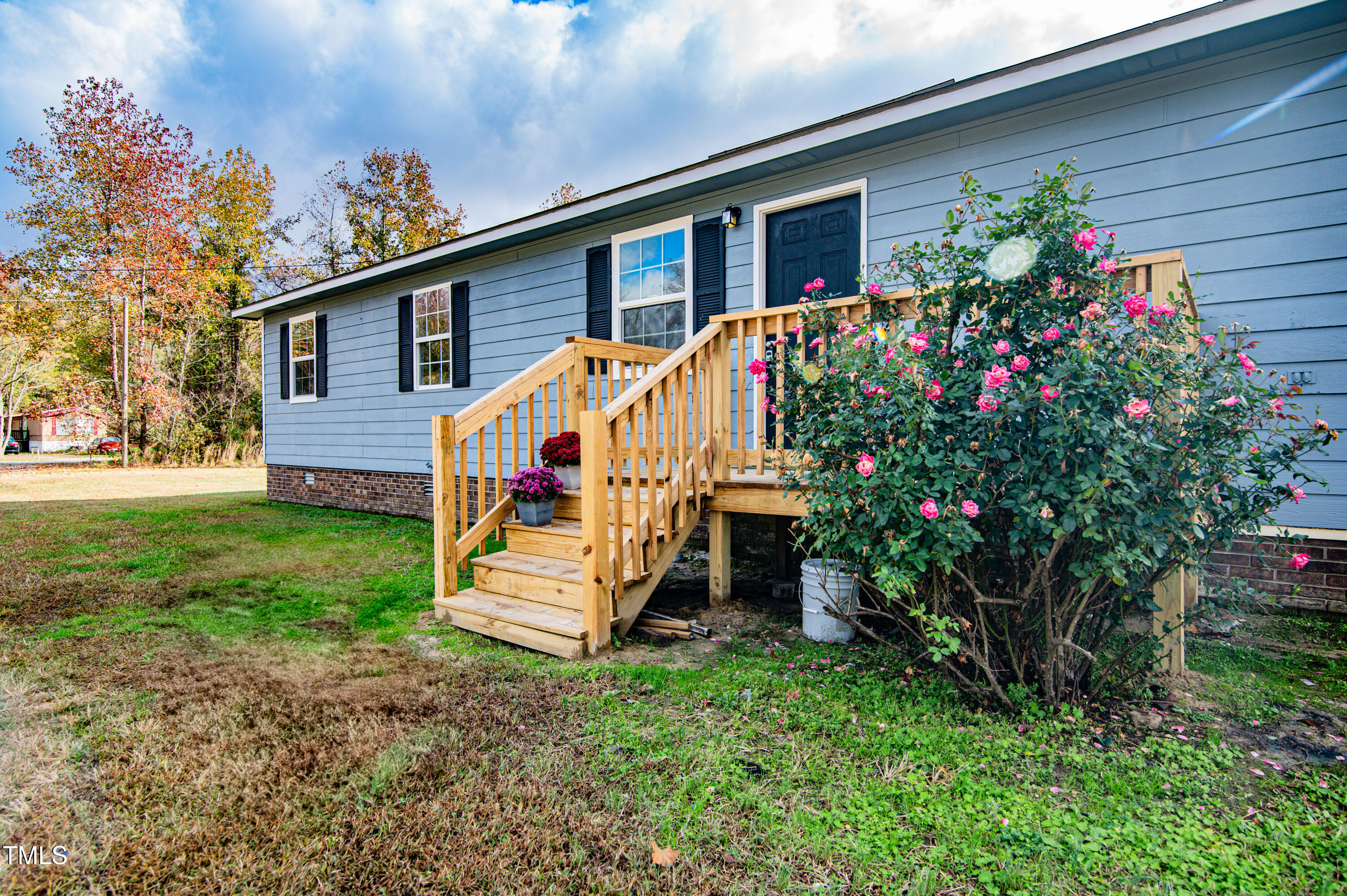 5046 Mrs Mag Road Conway, NC 27820 - Photo 2 of 38 a view of a house with a yard and garden