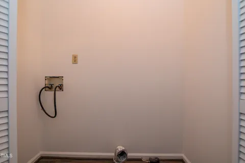 a view of hallway with wooden floor