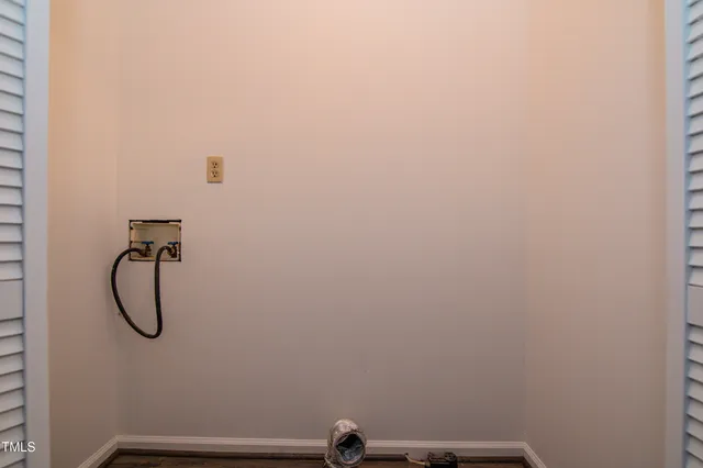 a view of hallway with wooden floor