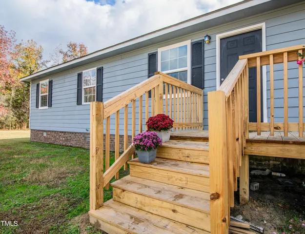 a view of a balcony with wooden floor