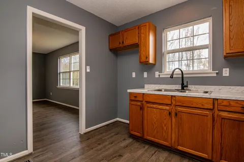 a kitchen with sink and window