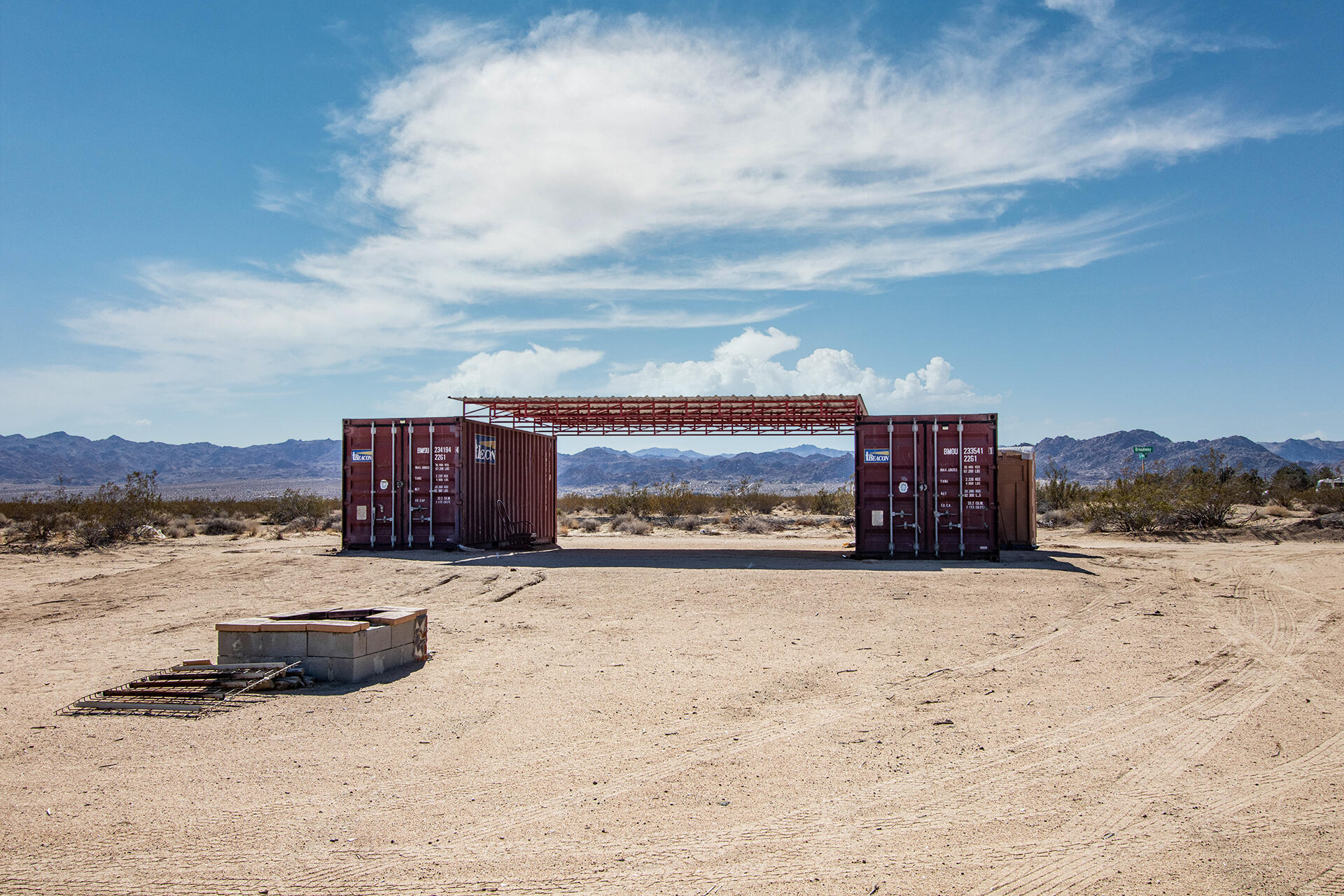 63682 Broadway Joshua Tree, CA 92252 - Photo 21 of 22 a view of a terrace with a building in the background