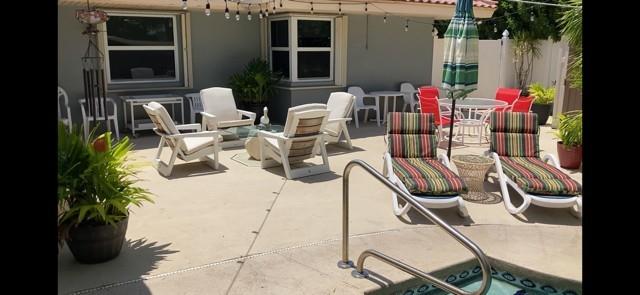 3096 Cadiz Road Boca Raton, FL 33432 - Photo 13 of 14 a view of a chairs and tables in patio